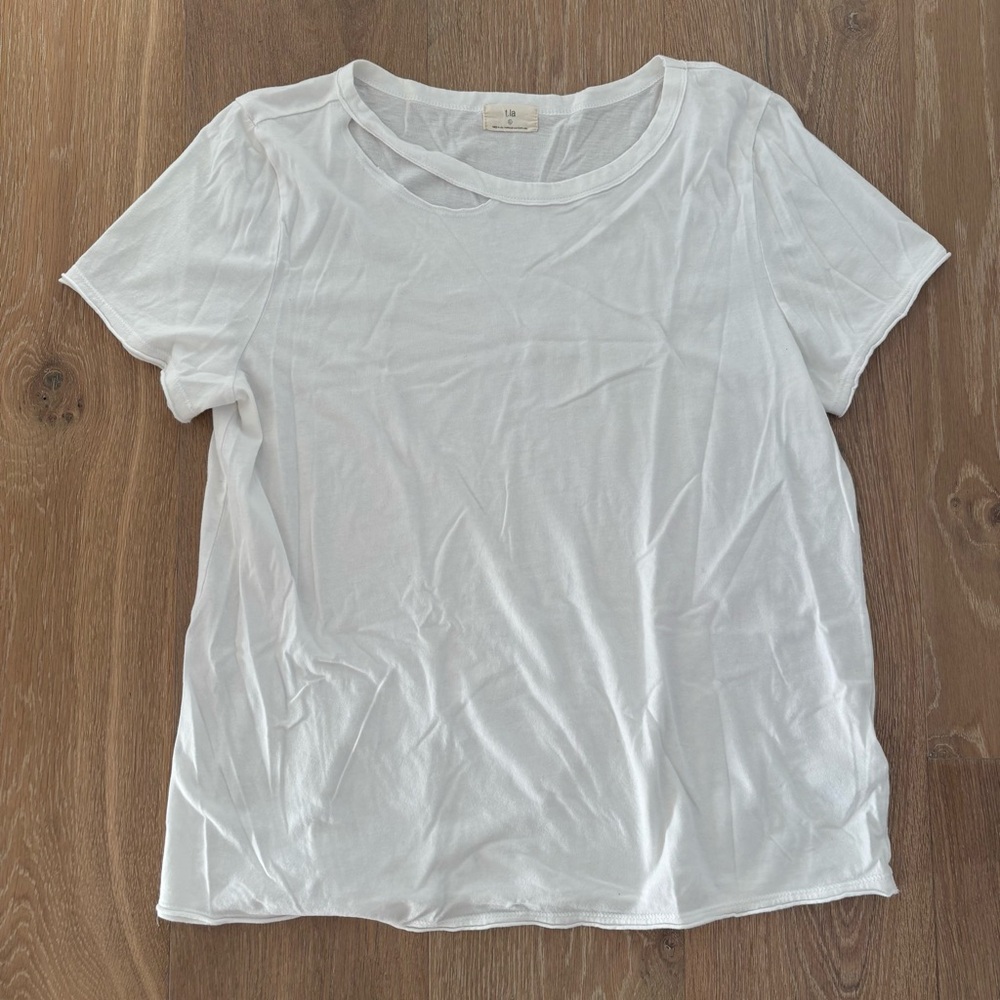 Anthropologie / t.la white t-shirt with “ripped” neckline